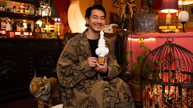 Moody Ko, managing director of niche fragrance boutique The Garden of Spring in Sydney’s Haymarket. He holds a perfume bottle with a custom topper made by one of his employees, Tah Chantarat, a scientist turned artist.