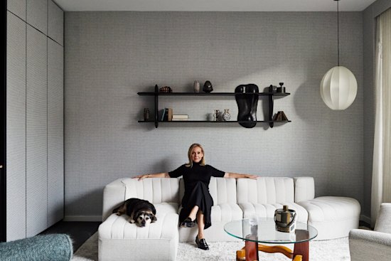 Tanya Hansen with her dog, Rosie, in the formal lounge. “I sit here at night and think, ‘How I love this place,’ ” she says. “Simone and Cindy have created a home that I adore.”