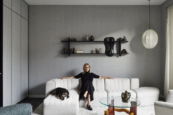 Tanya Hansen with her dog, Rosie, in the formal lounge. “I sit here at night and think, ‘How I love this place,’ ” she says. “Simone and Cindy have created a home that I adore.”
