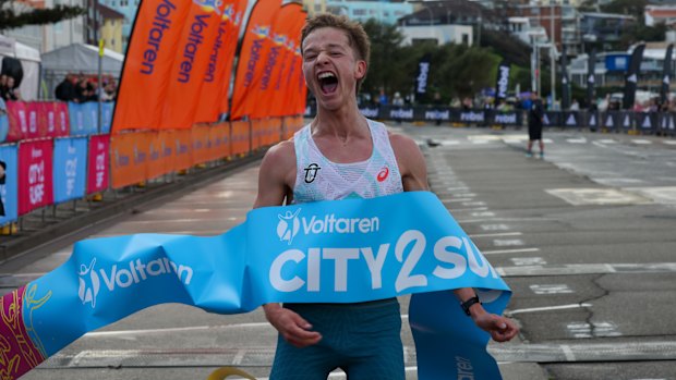 Isaac Heyne crosses the finish line  to win the 2025 City2Surf .