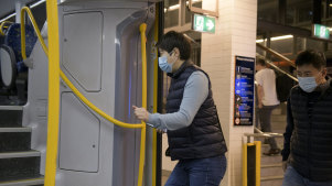 Sydneysiders wear masks on public transport during the COVID-19 pandemic.