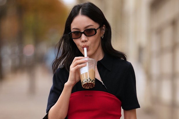 Jenny Tsang carries a bubble tea during Paris Fashion Week - Womenswear Spring Summer 2026, on October 06, 2025 in Paris, France