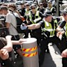 *Police use pepper spray as protesters attempt to stop conference members entering during a protest against The International Mining and Resources Conference in Melbourne, Wednesday, October 30, 2019.