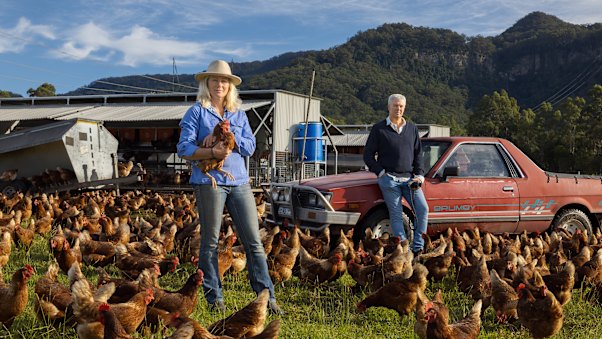 Kristen McLennan at her free-range chicken farm in Kangaroo Valley with filmmaker Ian Darling, whose documentary on silence and solitude a rural community will premiere at the Sydney Film Festival in June.