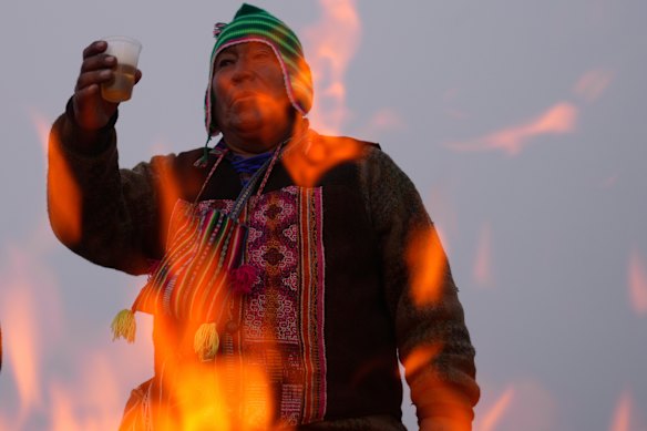 Spiritual leader Eusebio Huanca burns offerings observing the month of Pachamama, or Mother Earth, performing an ancient tradition to ask for a good harvest, on La Cumbre, a mountain considered sacred on the outskirts of La Paz, Bolivia.