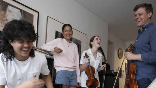 Music teacher Max Holtzner with students Charlie and Stella Mackenzie and Eve Barrington.