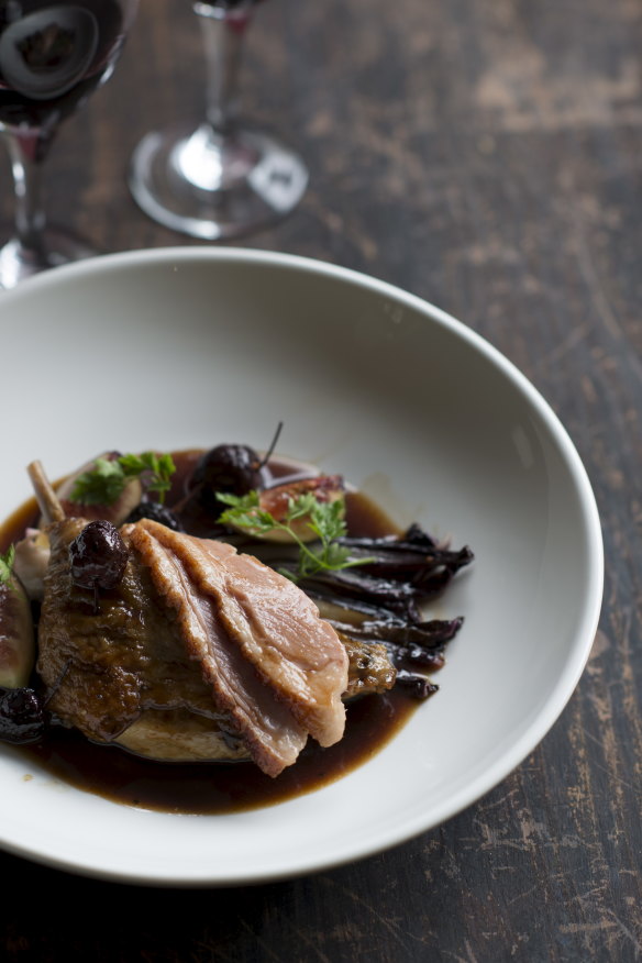 Confit duck leg with roasted fig and cherry jus.