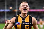 Jack Ginnivan of the Hawks celebrates the win.