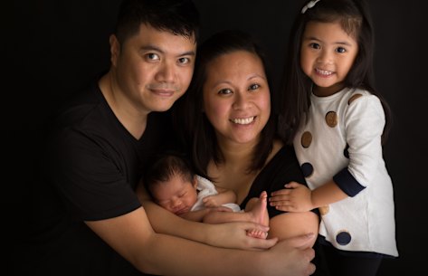 Caitlin Cruz, right, with her parents Mitch, Marie and younger sister Chloe.