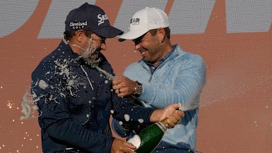 Hennie Du Plessis and Charl Schwartzel celebrate after their Stinger team took out the teams event.