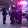 Police at the scene in Henry Street, Lewisham, where a man was shot dead and another man was in a critical condition. 