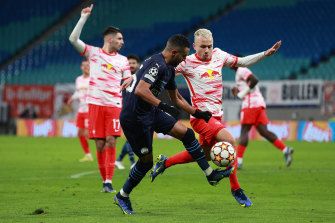 City’s Riyad Mahrez jostles for possession with Angelino of RB Leipzig during their Champions League Group A clash in Germany.