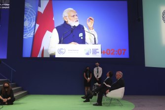 Netherlands PM Mark Rutte and Scott Morrison listen as Indiaâ€™s PM Narendra Modi speaks at the climate summit.