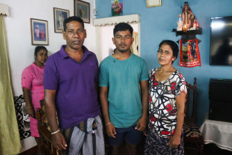 Warnakulasuriya Julian Priyanshan Fernando (centre) with his parents Emmanuel Anandan Fernando and Warnakulasuriya Mallika Rojini Fernando at their home in Negombo.