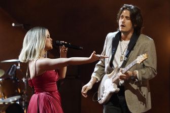 Maren Morris, left, and John Mayer perform The Bones at the 63rd Grammy Awards.