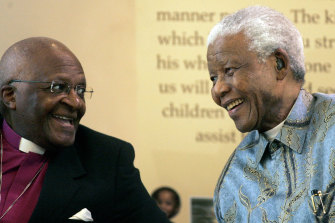 Former South African President Nelson Mandela, right, with Archbishop Desmond Tutu, left, in Johannesburg in 2008.
