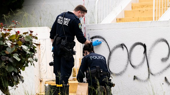 Forensic police examine damage to a property in Maroubra.