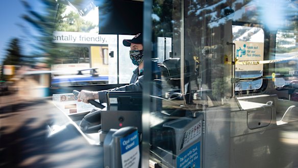 A NSW bus driver wears a homemade face mask. 