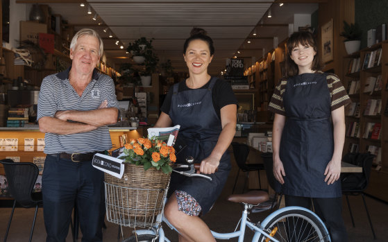 Ray Bonner and employees Manea, middle, and Jess, of Sydney's Bookoccino, are home delivering books to people who don't want to venture out during the coronavirus pandemic. 