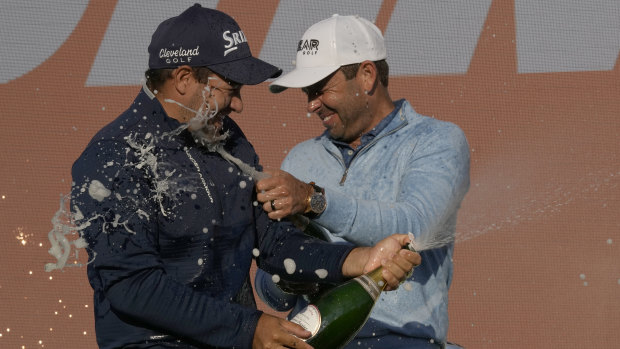 Hennie Du Plessis and Charl Schwartzel celebrate after their Stinger team took out the teams event.