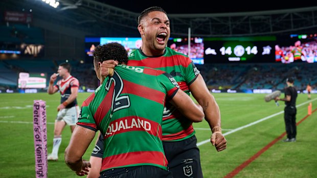 Latrell Mitchell and Isaiah Tass celebrate the match winner on Friday night.