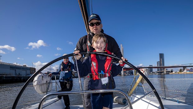 Dylan takes his turn at the helm in a sailing adventure for students from Officer Specialist School.  