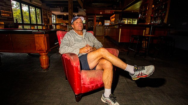 Mallacoota Hotel owner Lou Battel sits in the empty bar.