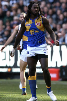Nic Naitanui limps off field on Sunday during the Eagles' clash with Collingwood at the MCG. 