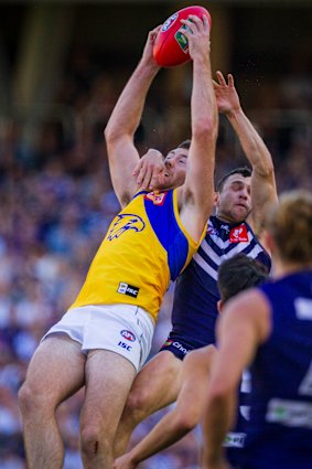 Good grab: West Coast's Jeremy McGovern marks in front of Fremantle's Hayden Ballantyne.