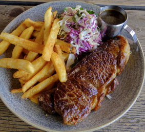 Porterhouse steak, chips and salad.