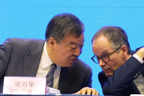 Only two weeks to conduct study: Peter Ben Embarek, of the World Health Organisation team, right, chats with his Chinese counterpart Liang Wannian during a WHO-China Joint Study Press Conference.