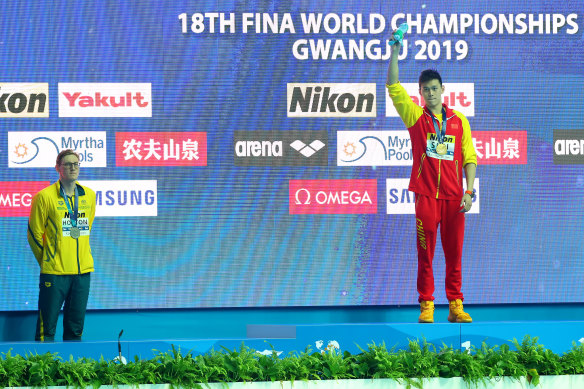 Mack Horton, left, makes his protest about Chinese gold medallist Sun Yang during the 2019 FINA World Championships medal ceremony in Gwangju, South Korea, in 2019. Chinese social media made hay of the episode.
