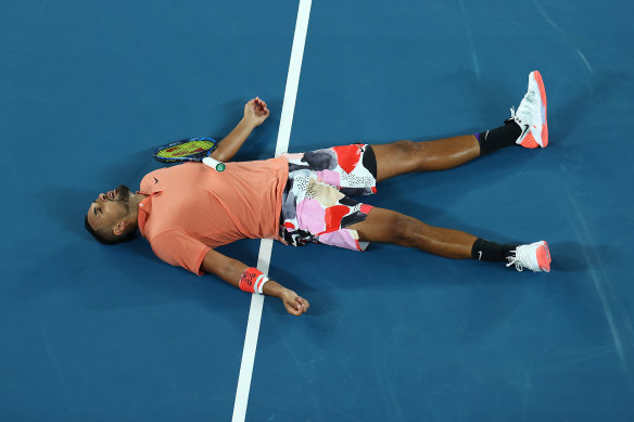 Work rate: Kyrgios lies on the court after losing a point to Nadal.