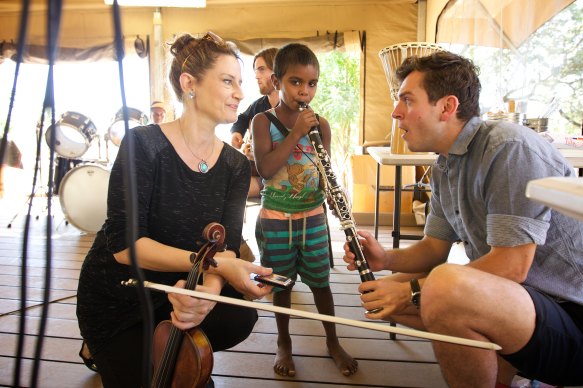 Members of the Sydney Symphony Orchestra in the Northern Territory prepare for the production of Jandamarra.