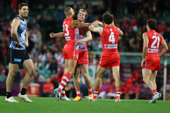 Lance Franklin of the Swans and Nick Blakey of the Swans celebrate.