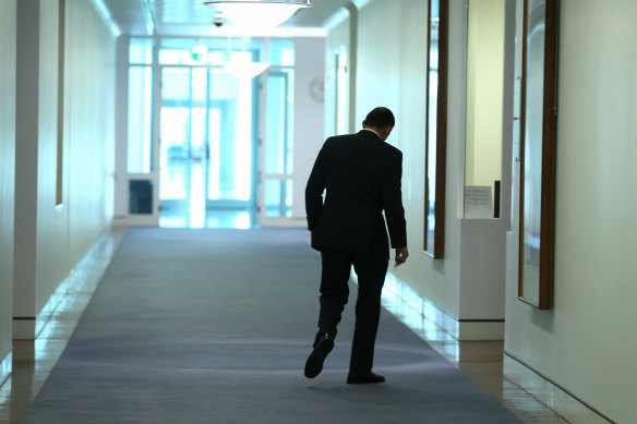 Tony Abbott walks back to his office at Parliament House after providing an update to the media in the wake of the MH17 crash.