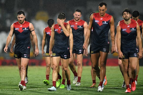 Despair: The Demons walk off the field after their round 16 loss to Fremantle.