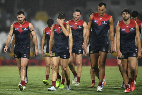 Despair: The Demons walk off the field after their round 16 loss to Fremantle.