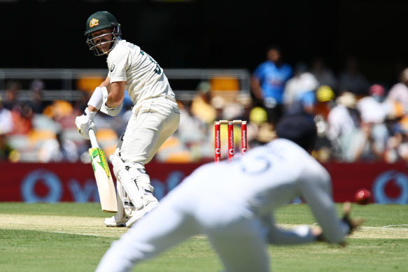 David Warner watches on as Rohit Sharma shapes for the catch in Brisbane.