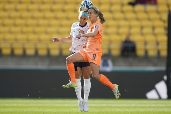 United States’ Julie Ertz, left, and Netherlands’ Katja Snoeijs jump for a header.