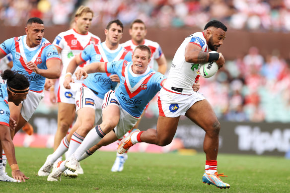 Francis Molo breaks away to score against the Roosters on Anzac Day last year.