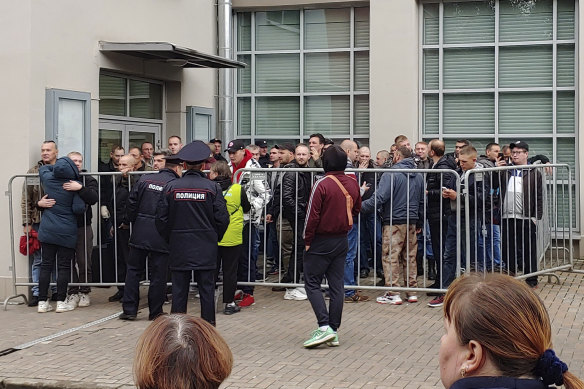 Russian recruits gather at an entrance of a military recruitment centre of Moscow, Russia, last month.