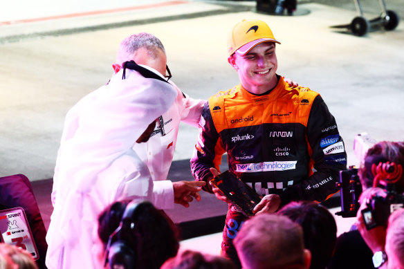 Oscar Piastri celebrates with his trophy after his sprint win in Qatar.