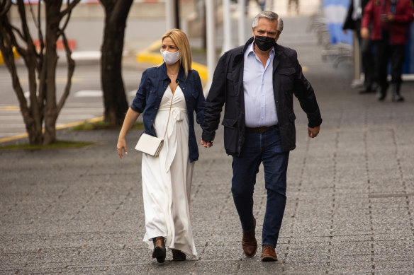 Former president of Argentina Alberto Fernandez arrives with then-first lady Fabiola Yañez to cast his vote during midterm elections in Buenos Aires in 2021.