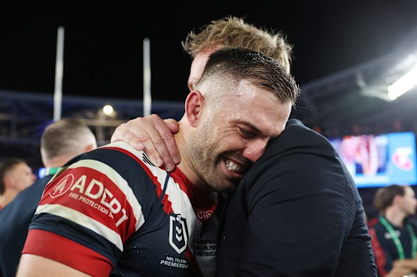James Tedesco celebrates the Roosters’ premiership win with coach Trent Robinson.