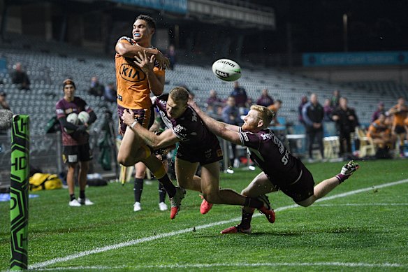 Tom Trbojevic denies Xavier Coates late in the game.