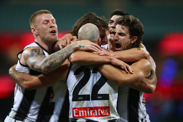 Steele Sidebottom celebrates kicking a goal. 