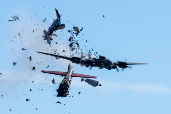 Photos show the moments after a Boeing B-17 Flying Fortress and a Bell P-63 Kingcobra collide in midair during an airshow at Dallas Executive Airport.