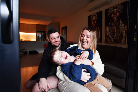 Kara Napper with her husband, Dave, and son, Charlie, 2 at home in Kirrawee.