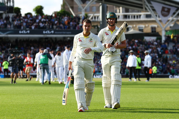 Alex Carey and Josh Hazlewood leave the field after losing the Oval Test to draw the Ashes series.